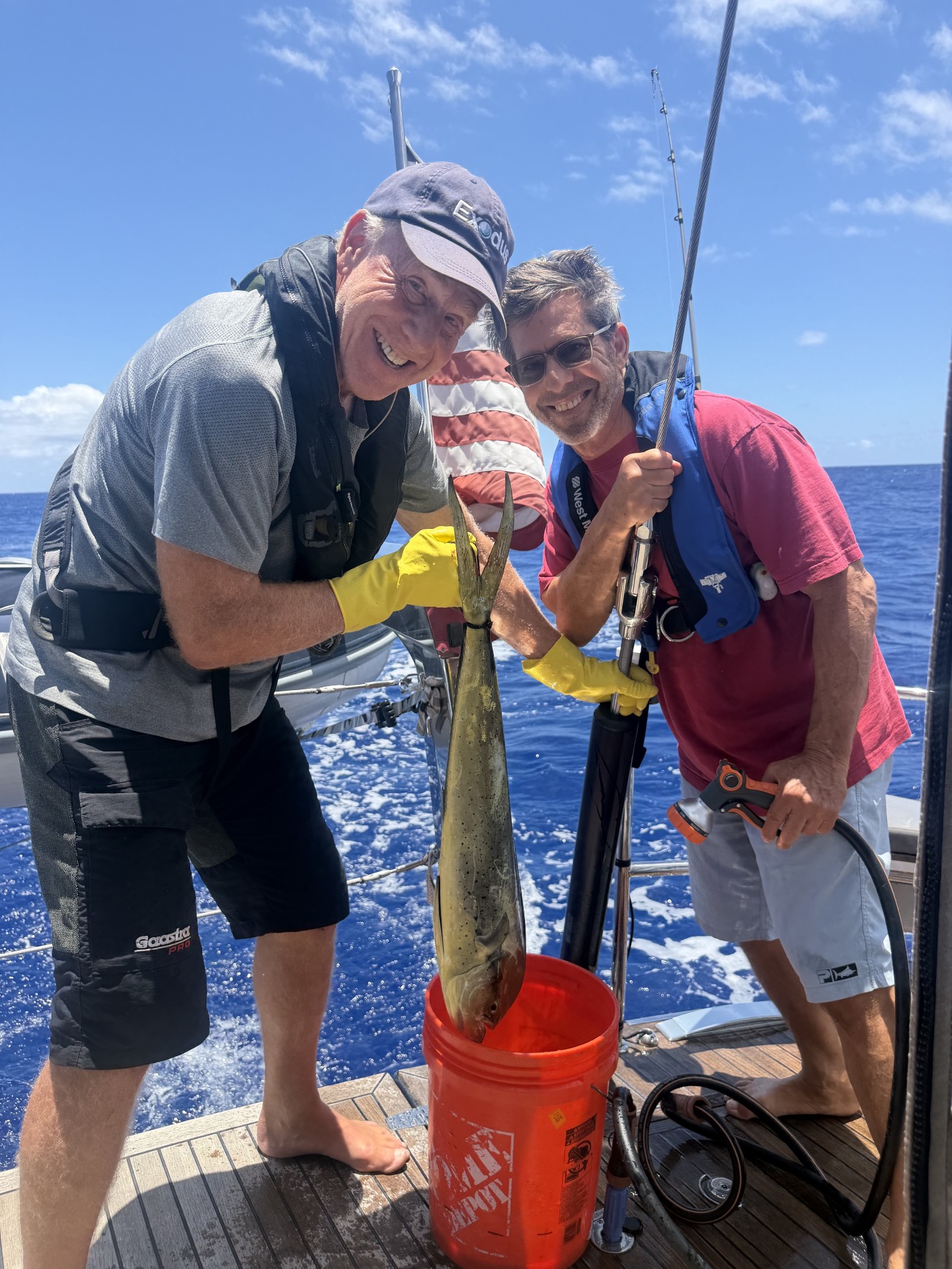 Crew showing off a fish caught during the Bermuda passage